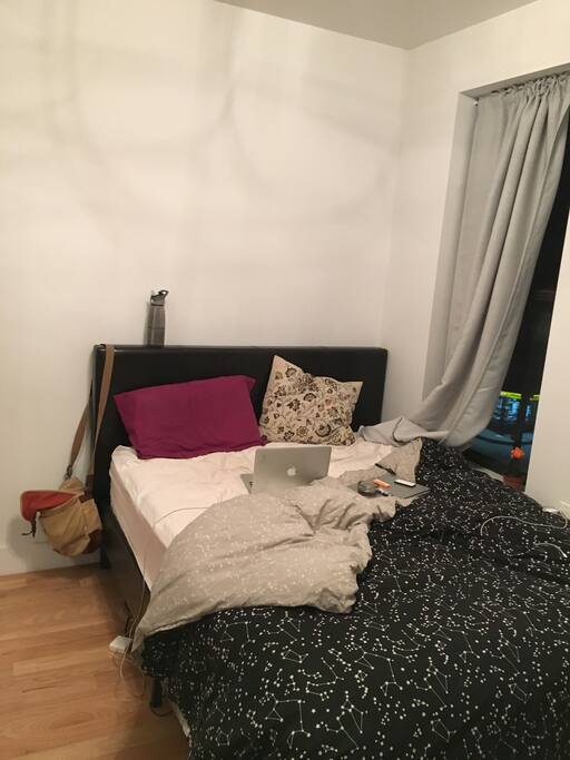 Massive queen sized bed window overlooking Saint Nicholas street. Great lighting.