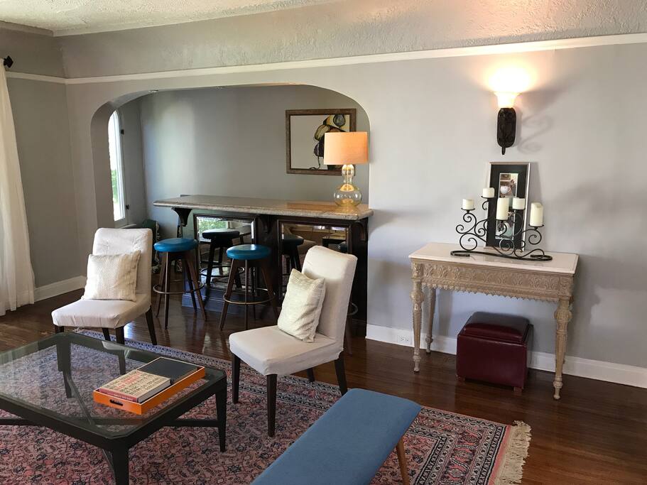 View of the bar area from inside the living room. There is now a gigantic HD TV hanging on the wall above the bar (with Apple TV).