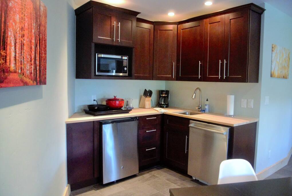 Kitchen with 2 ring stove, convection oven and microwave, fridge/freezer and dishwasher