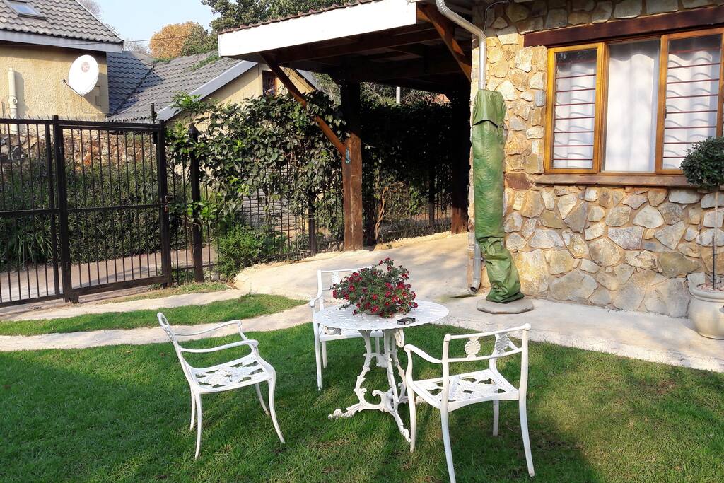 View of car port and sliding gate