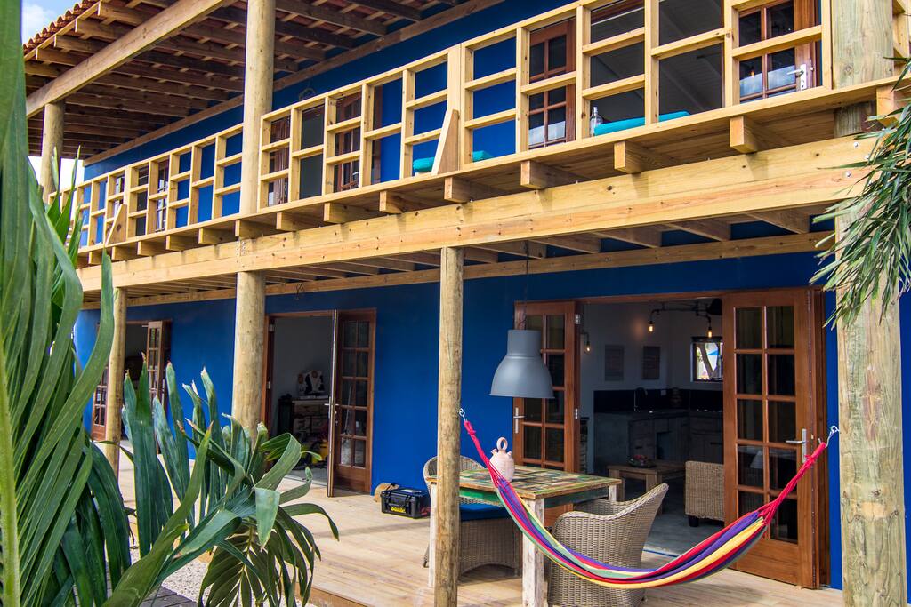 downstairs porch and upstairs balcony