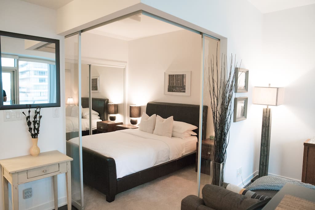 Bedroom with glass sliding doors and black out curtains