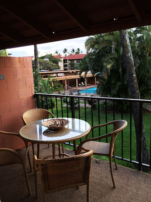 Part of the view from the HUGE lanai over the pool area and lush tropical landscaping.
