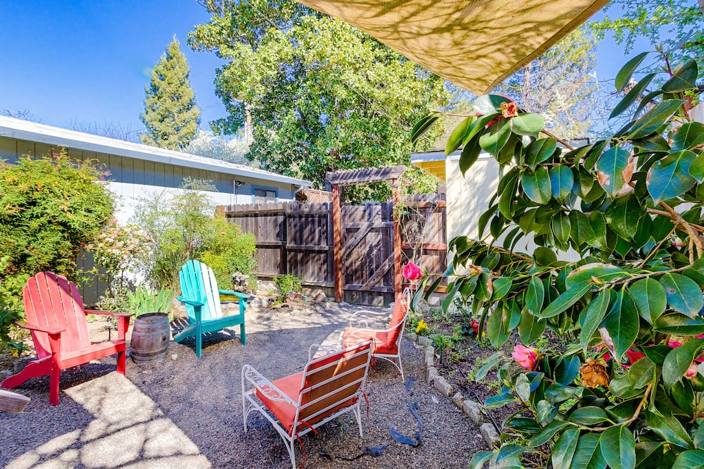 Step outside to the quiet back deck with lush plants