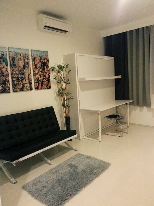 Murphy bed goes up in the day and you have another place to work from/more space :)