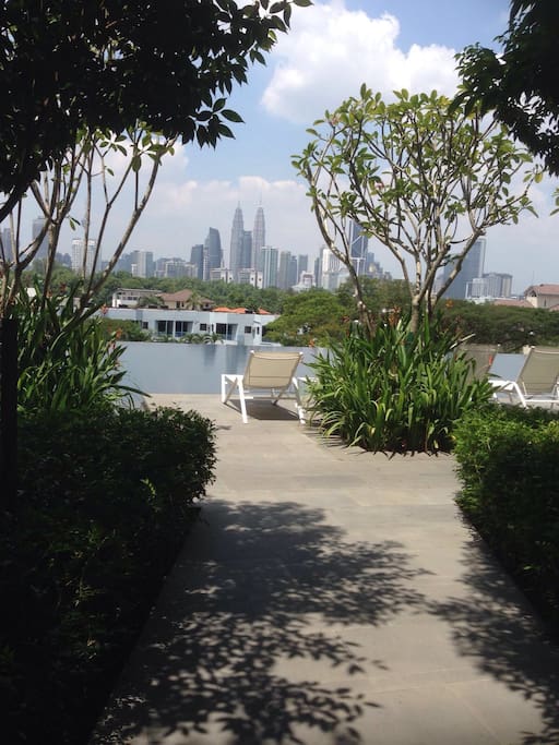 Swim or lounge with the city skyline and the iconic Petronas Twin Towers in the background.
