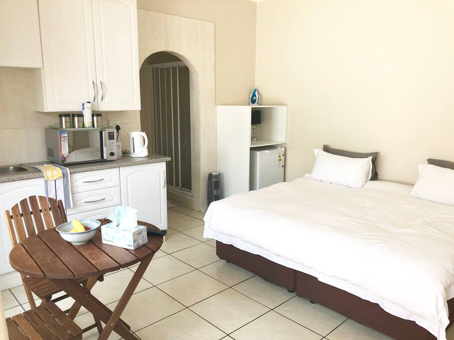Studio with kitchen, dining and archway to en-suite bathroom