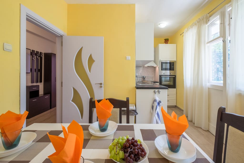 Bright, sunny and fully equipped KITCHEN + dining area with access to the balcony