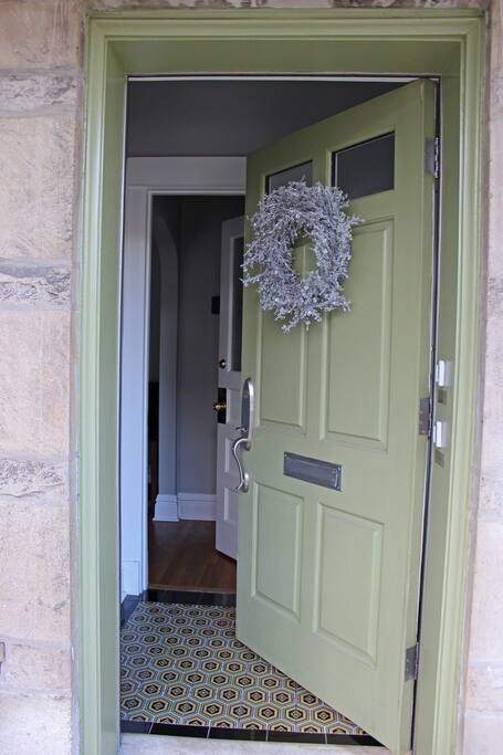 The entryway and door to the 1st floor unit. For safety we keep the porch and foyer lights on all night.
