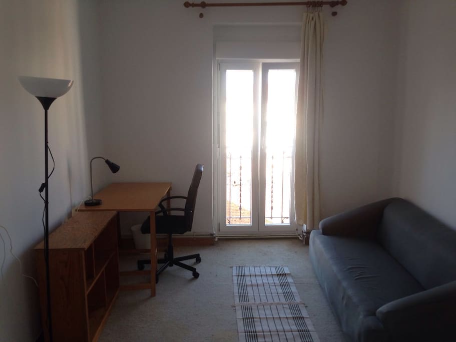 Very bright huge bedroom with balcony. King double bed, massive wardrobe, sofa and desk