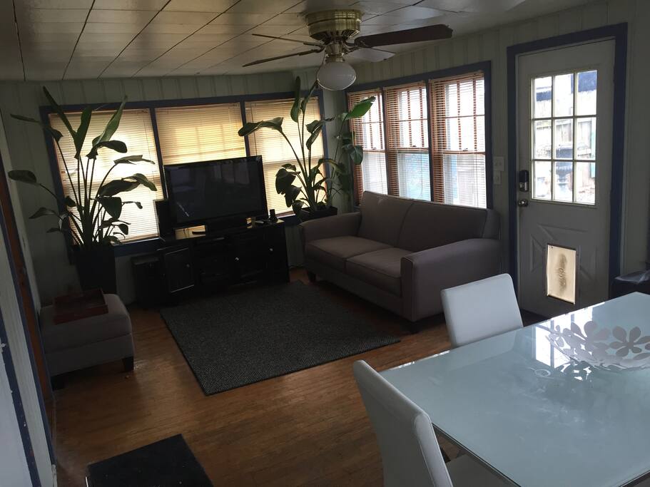 A spacious Back Living Room with lots of natural light