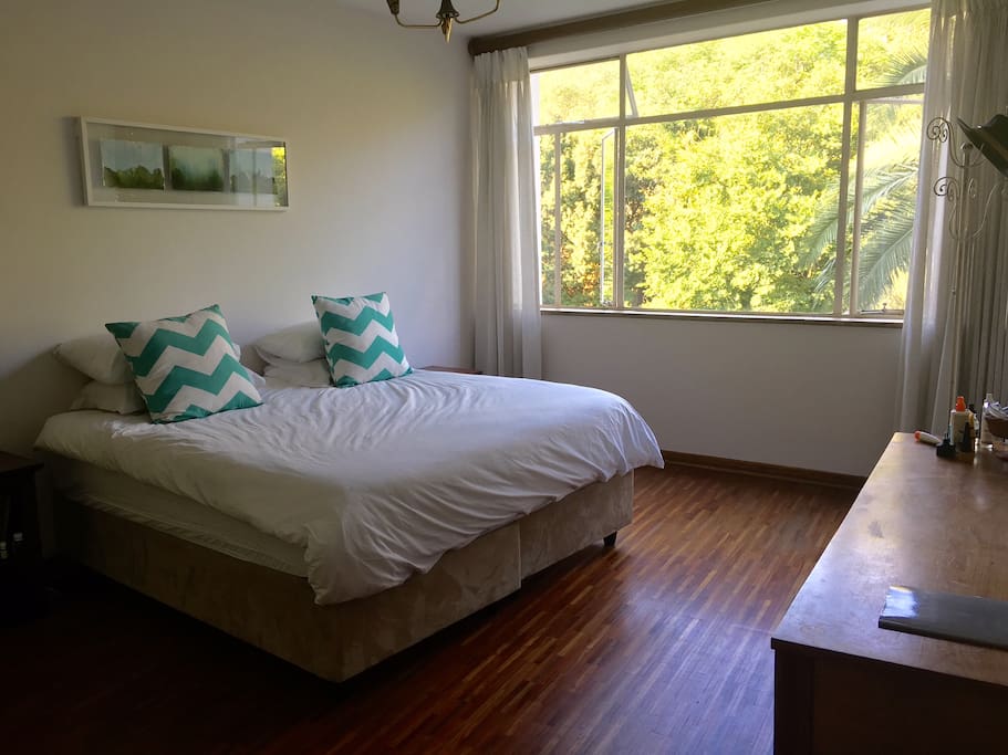 Large, airy main bedroom with kingsized bed and a beautiful view of the garden