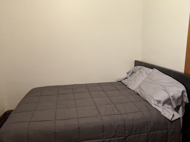 Main floor bedroom with comfortable double bed