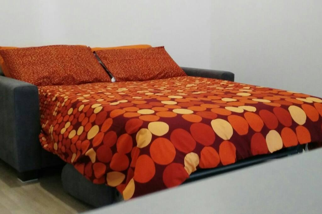 Soggiorno con divano letto