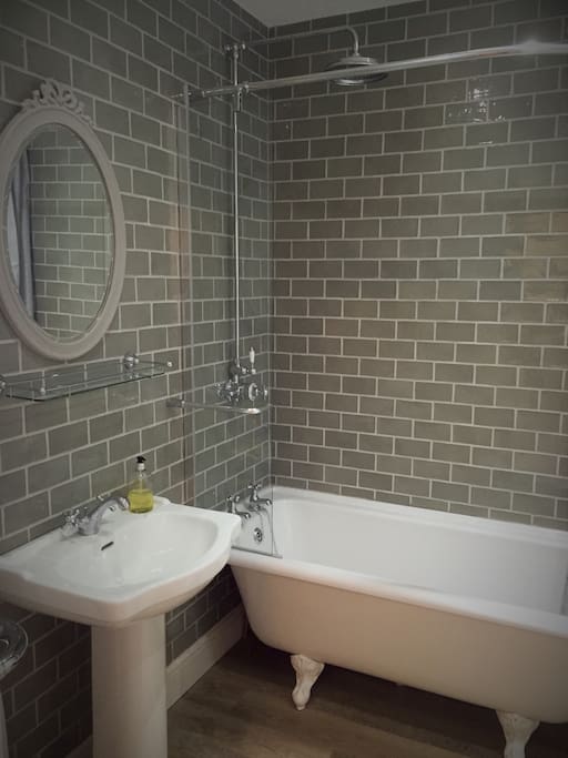 Bathroom with roll top bath and powerful shower