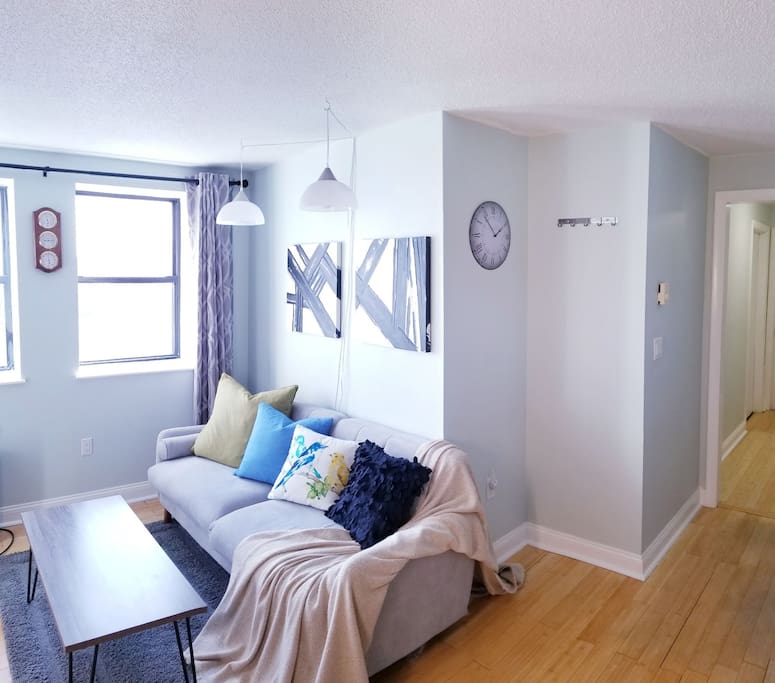 Modern, spacious city retreat offering a calming, peaceful open concept and an expansive view of the city skyline over the Boston Harbor. Common area offers a full entertainment center and comfortable couch to relax after a day in the city.