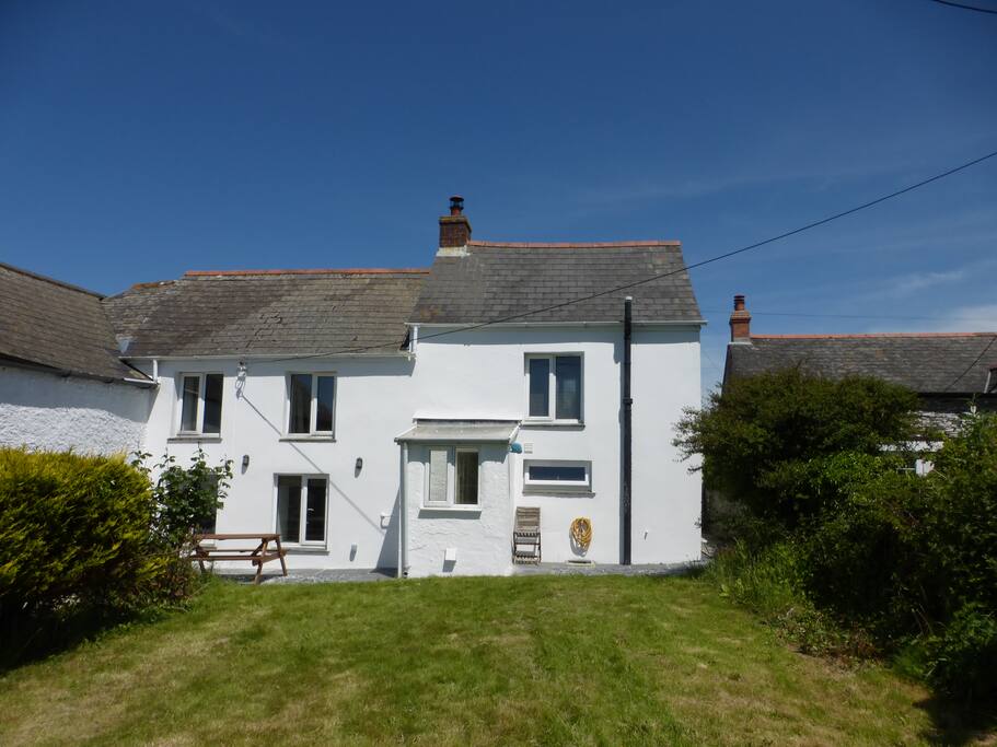 Large enclosed south facing rear garden with picnic benches, bbq and awesome views.