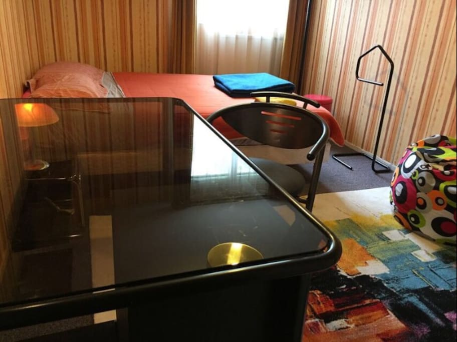 Bedroom fully equipped. Very large transparent desk.