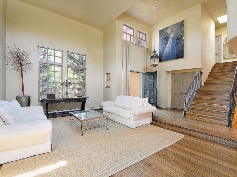 Living Room with Clerestory Ceilings, Hardwood Floors, Privacy, Designer Furniture, & Fine Art.