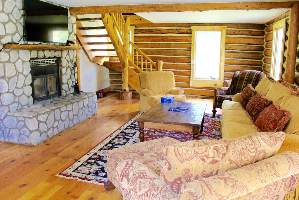 Come relax in this cozy and inviting living space. It has a working fireplace, perfect for the winter nights, and elongated windows to allow natural light and views of the Gore Creek.