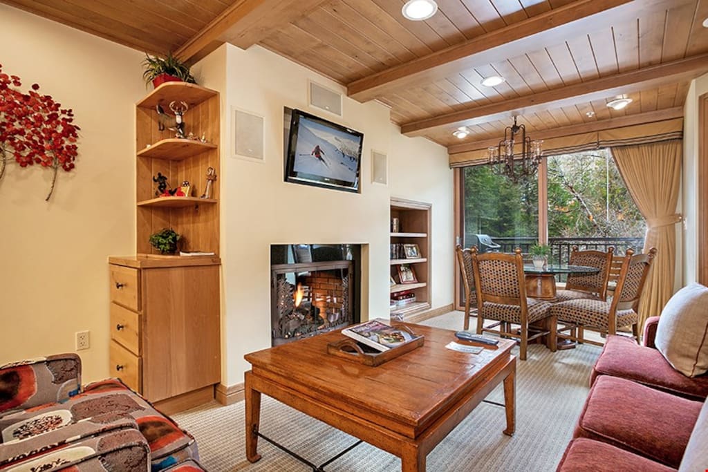 Kick back and relax in the spacious living area, complete with fireplace.