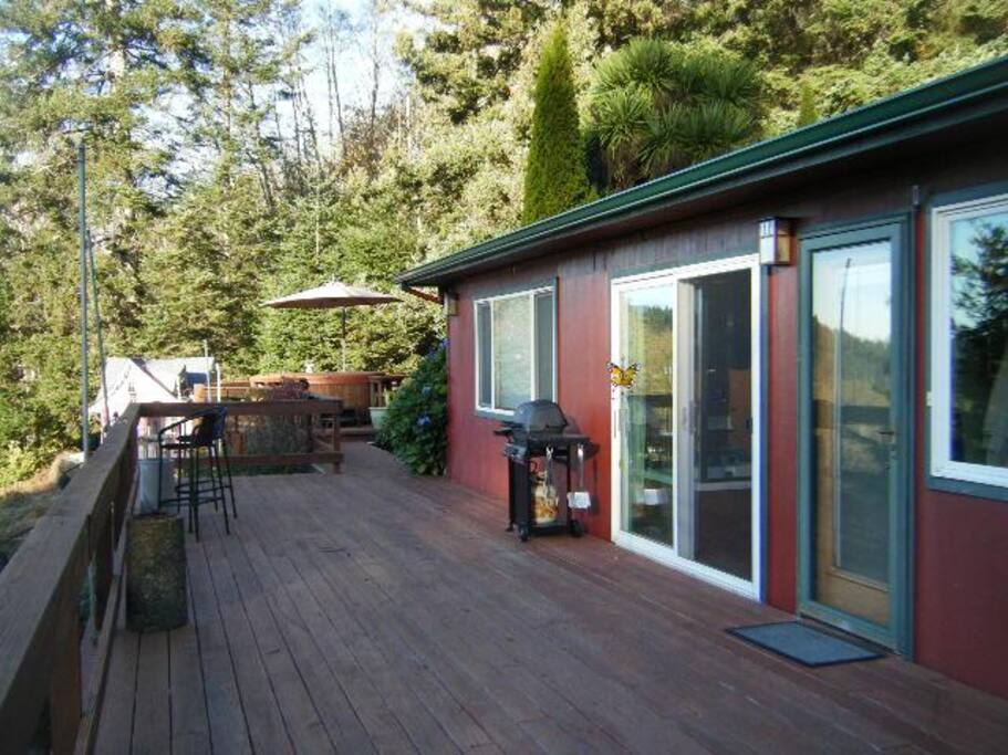The spacious thousand square foot deck with a sound system where you can do your morning workout. Yoga mats provided. Also has a barbeque and an ocean view.