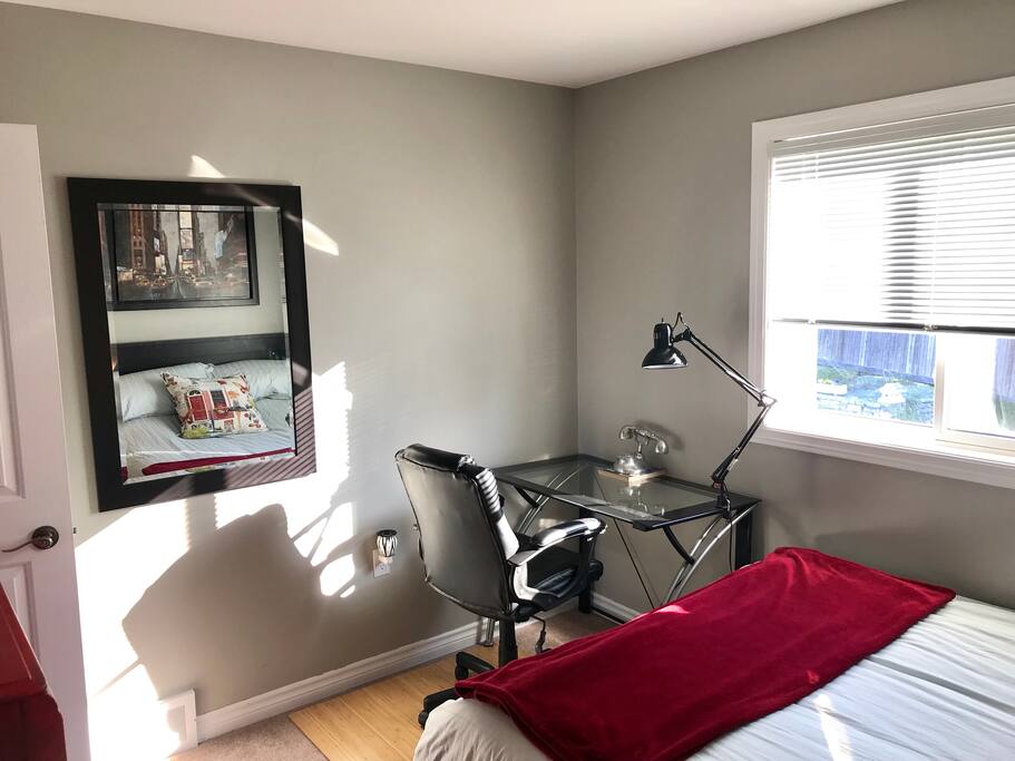 Bedroom - another angle, desk and comfy chair.