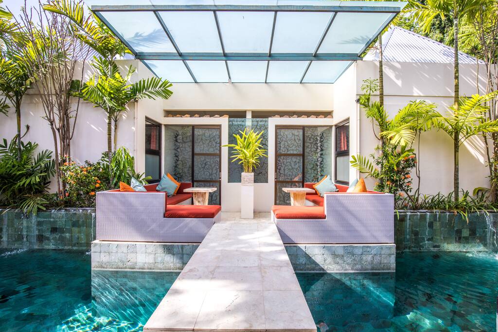 Poolside Terrace Suite overlooking swimming pool.