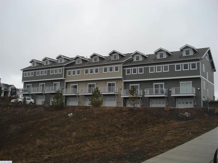 Back of Condo with plenty of private parking