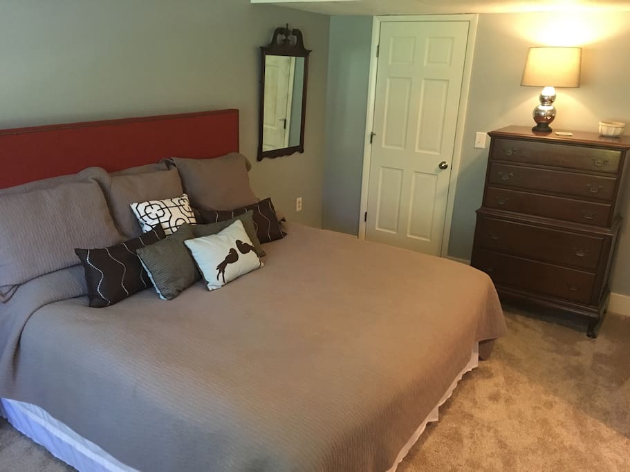 Cozy, comfy KING bed. Hanging clothes can be hung on door next to mirror.