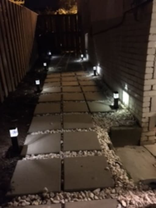 After opening gate, walkway to enter the unit.