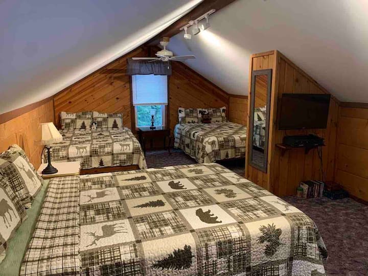 The upstairs loft bedroom has all new beds and mattresses. There is a nice area with a 32” flat screen TVs and DVD player. 
