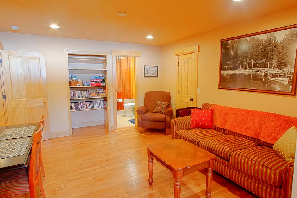 Living Area with Couch, Lazy-Boy, Expanding Table, Coffee Table, & TV w/DVD Player (no cable, but huge DVD library)