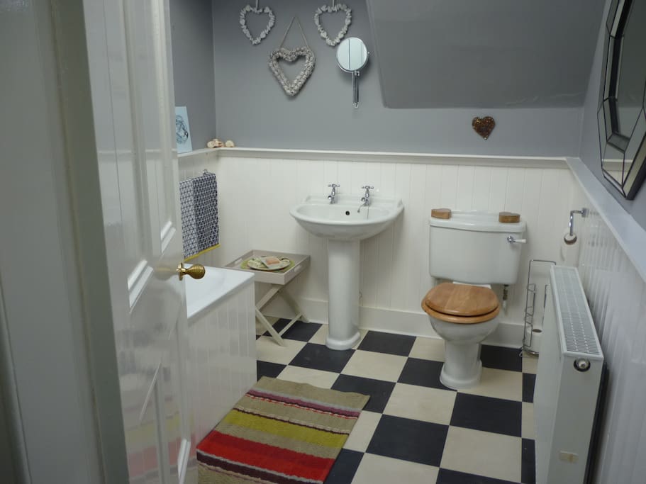 Bath with shower and some nice products for you.