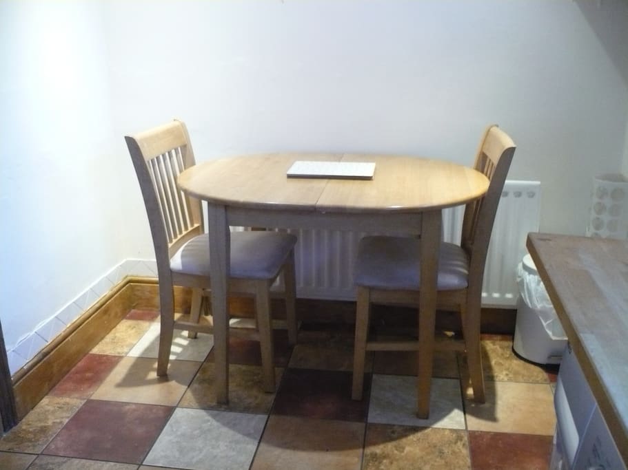 Dining table + 4 chairs for guests!