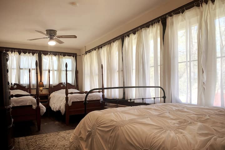 Bedroom 6 has a double bed and two single beds. 