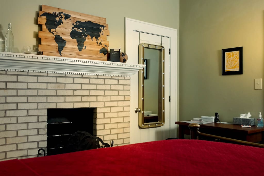 Another view of the bedroom. The physical key and Welcome Letter are sitting on the laptop-ready table.