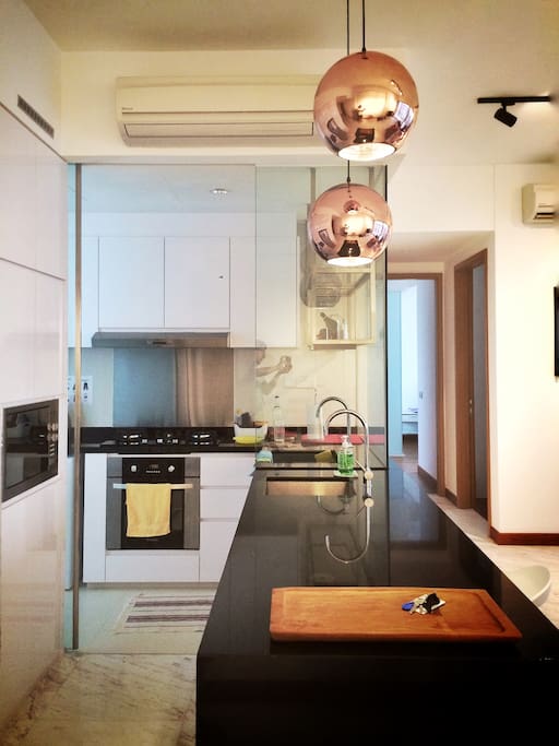 Fully functional kitchen with stove, oven, microwave and fridge. Comes with washing machine too!