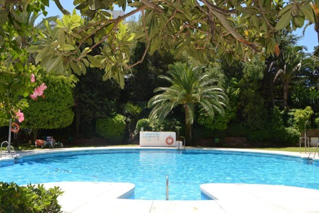 The shared swimming pool is set in pretty gardens with a large separate pool for children