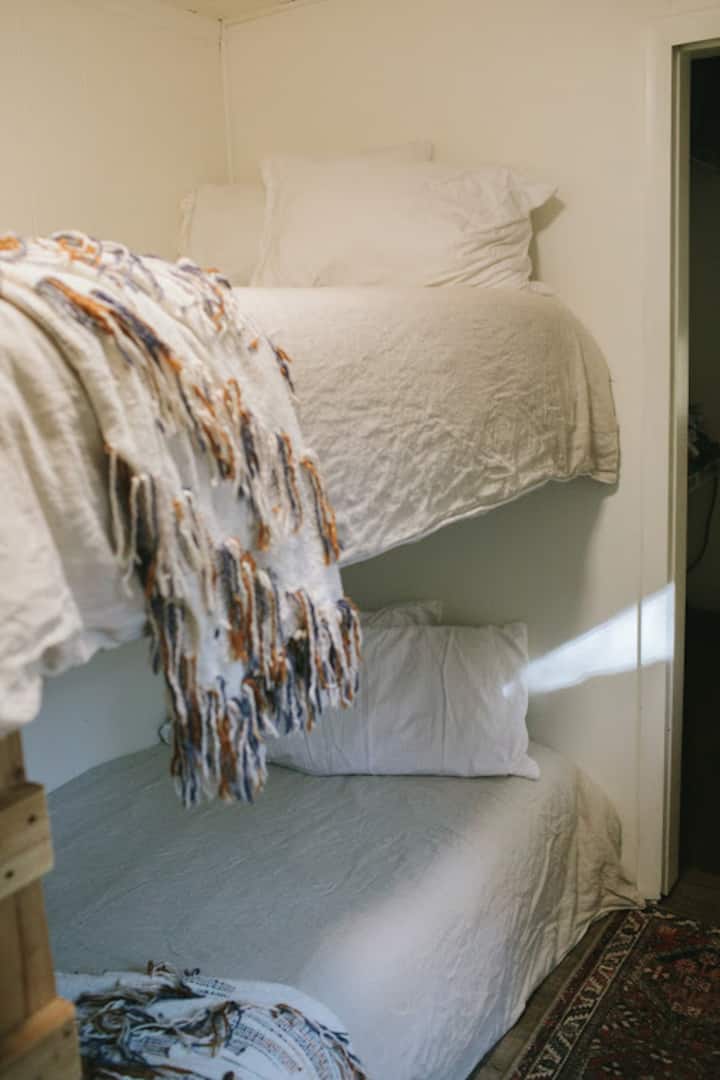 Bunkroom with two twins. Child safety rail available for top bunk.