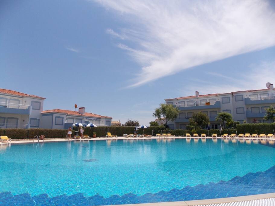 outside pool with sunbeds