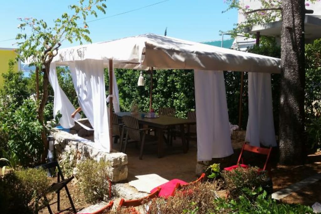 A spacious arbour for your complete comfort, including a barbecue