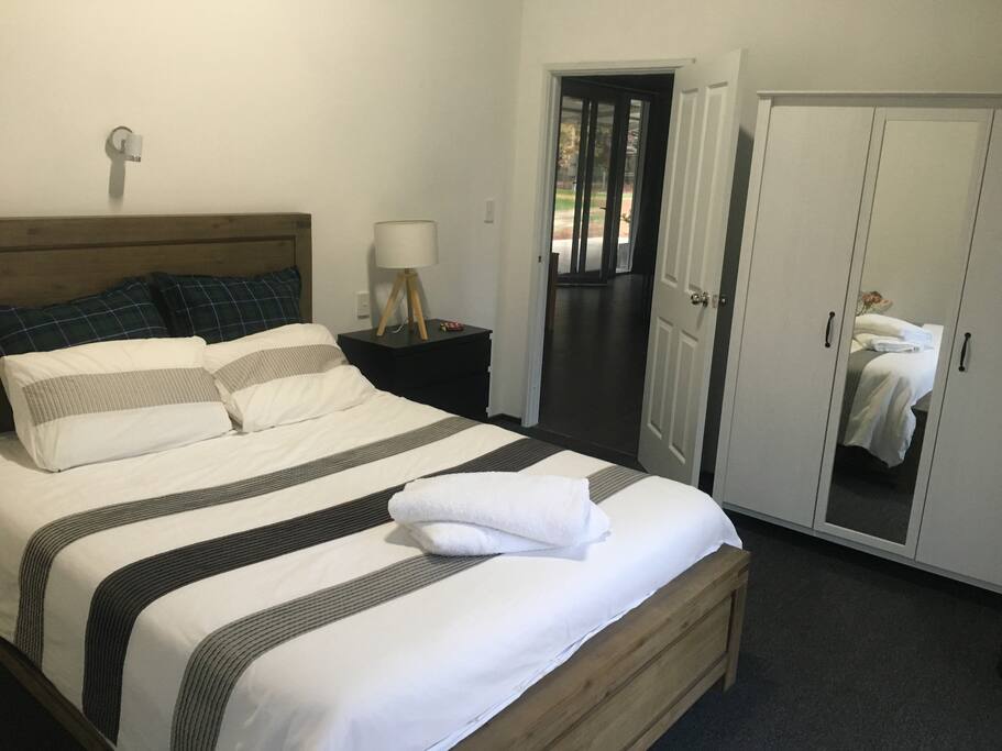 Queen bedroom with extra glass doors to the outside
