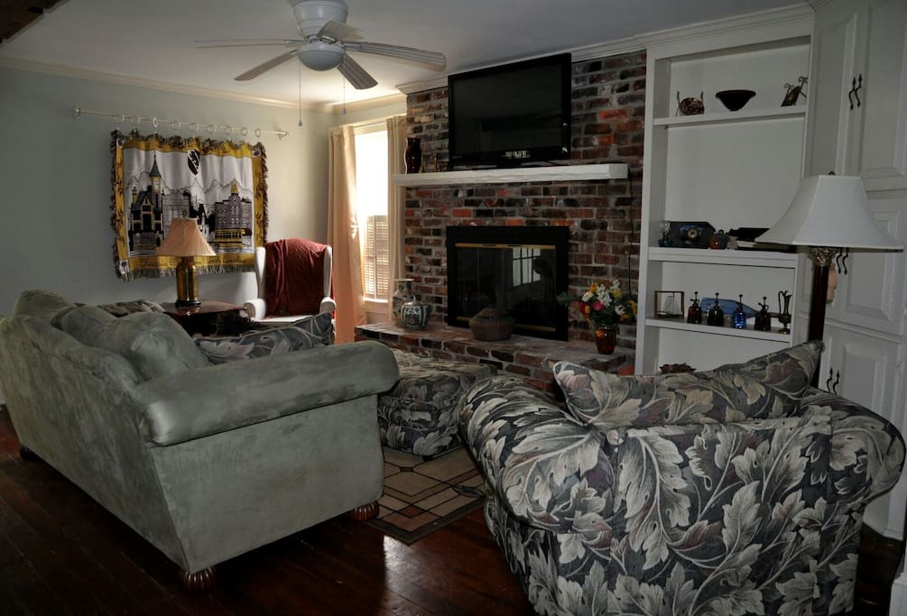 watch your favorite sports in this open living room and great room connected to the kitchen.