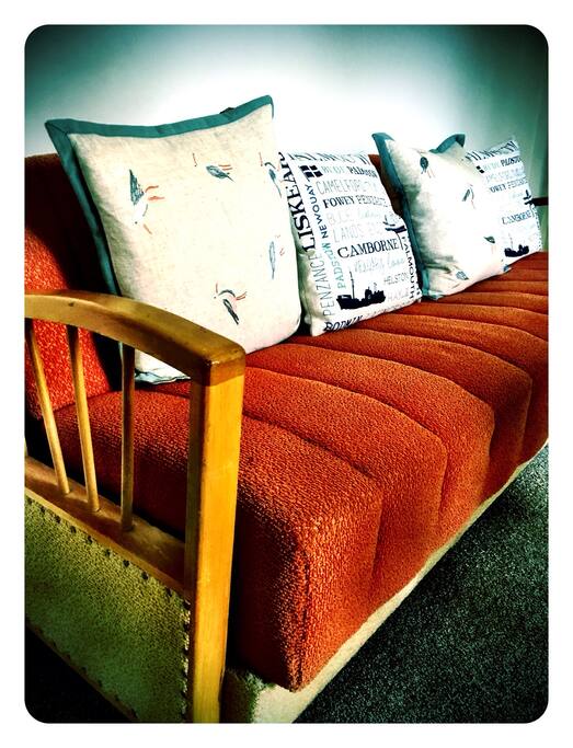 Orange sofa bed roomy enough for one adult