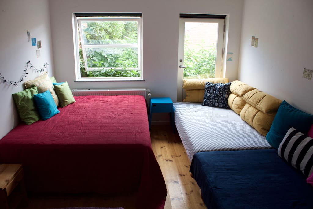 The two beds on the right are actually small doubles (also called three-quarter beds), not singles.