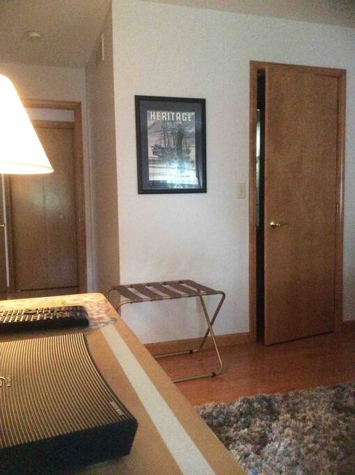 Hallway leading to bedroom with attached bath
