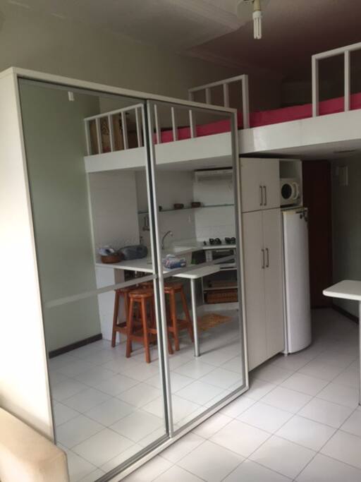 wardrobe with mirror and sliding doors. Mezzanine with double size mattress. Removable stairs to mezzanine.