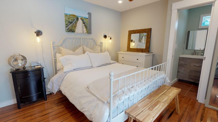 Master Bedroom with Queen bed and half-bath.  Room has a slider that goes onto private deck.  Mini-split heater/a/c in this room with a ceiling fan.  Linens provided for all beds.