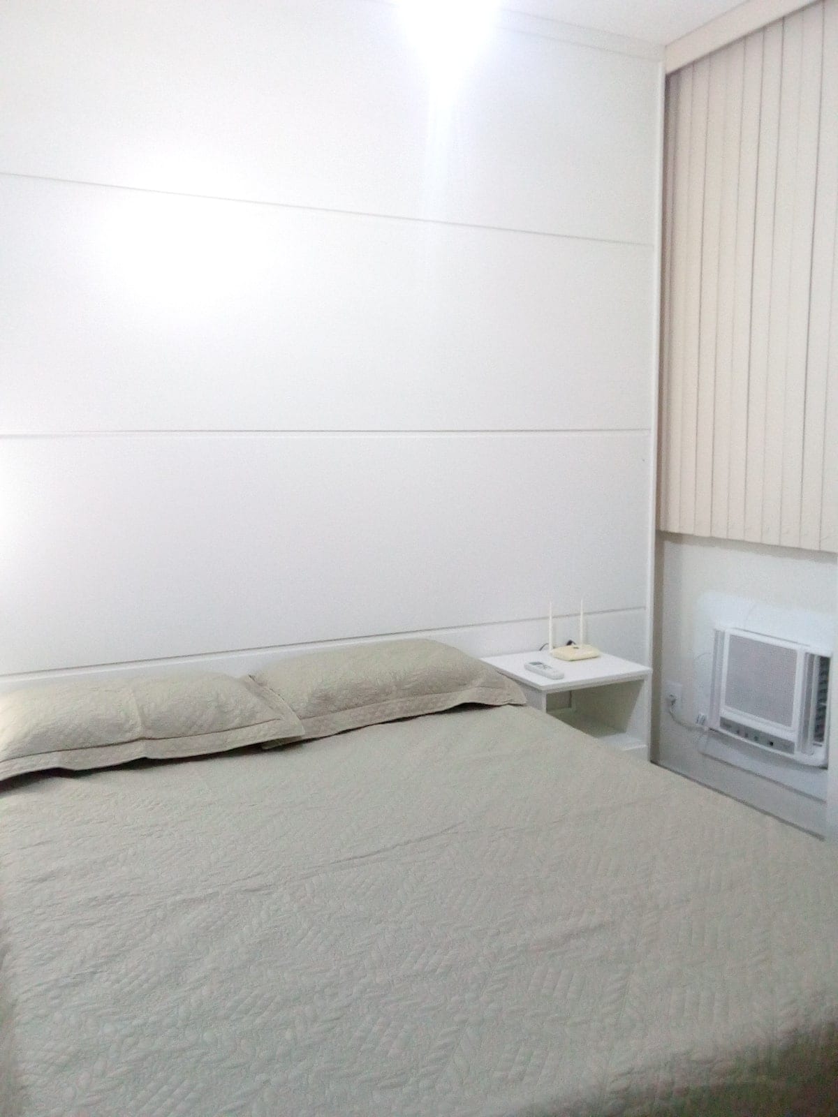 Bedroom with box spring , air conditioning, blinds, ceiling fan, two bedside tables, built-in wardrobe with mirror,  en-suite. 